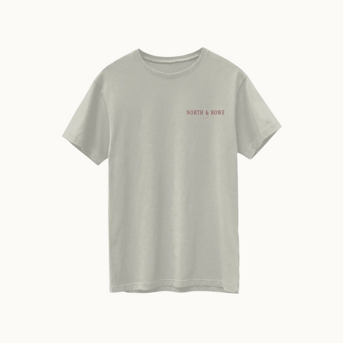 North & Rowe sage green Supima cotton t-shirt with a small chest logo on a dark background